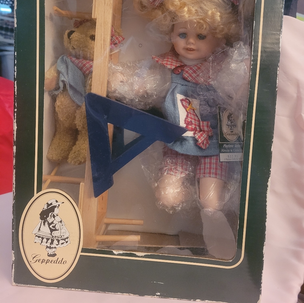 Geppeddo doll w/bear on teeter-totter